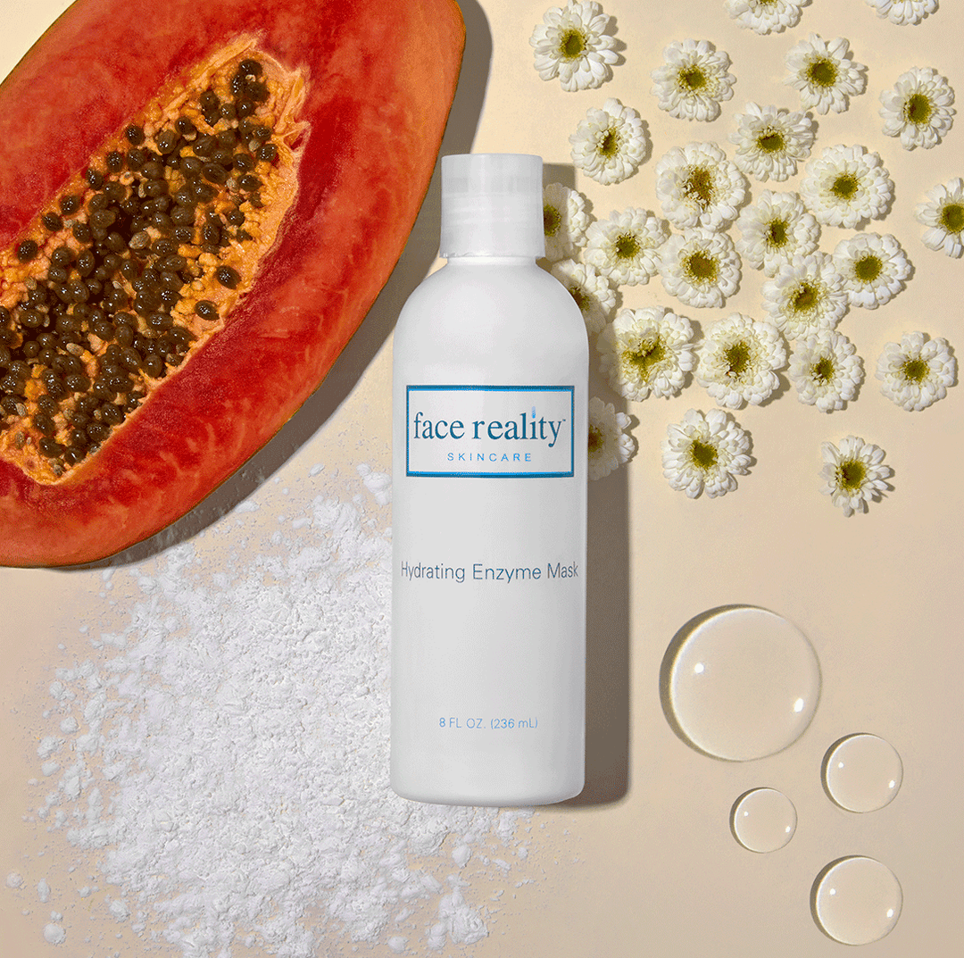 White bottle of hydrating enzyme mask 8 oz backbar against backgrond of flowers and fruit